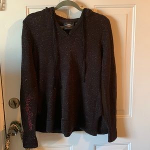 Slightly used size medium Harley Davidson hooded sweater with silver sparkles